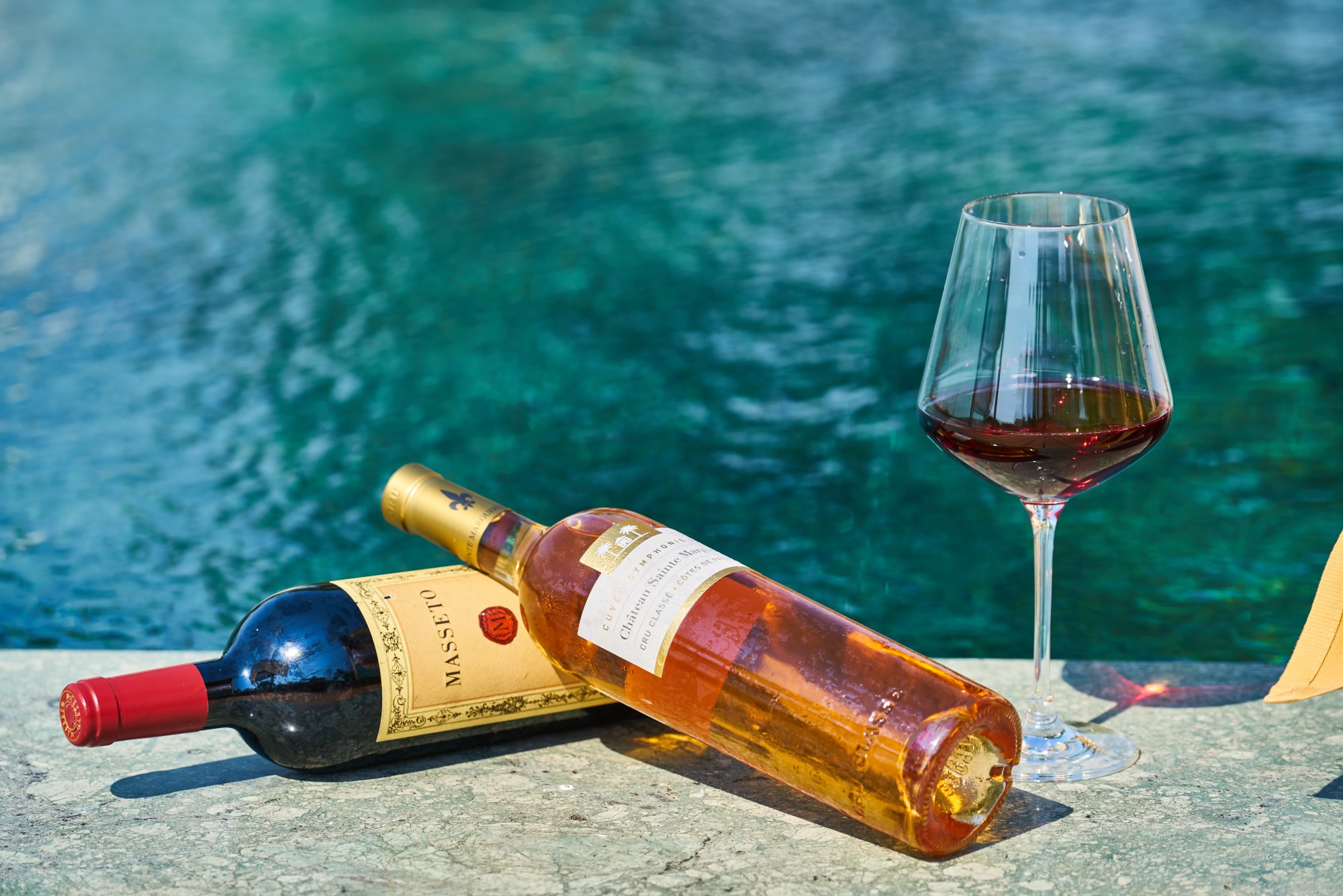 wine bottle by the pool